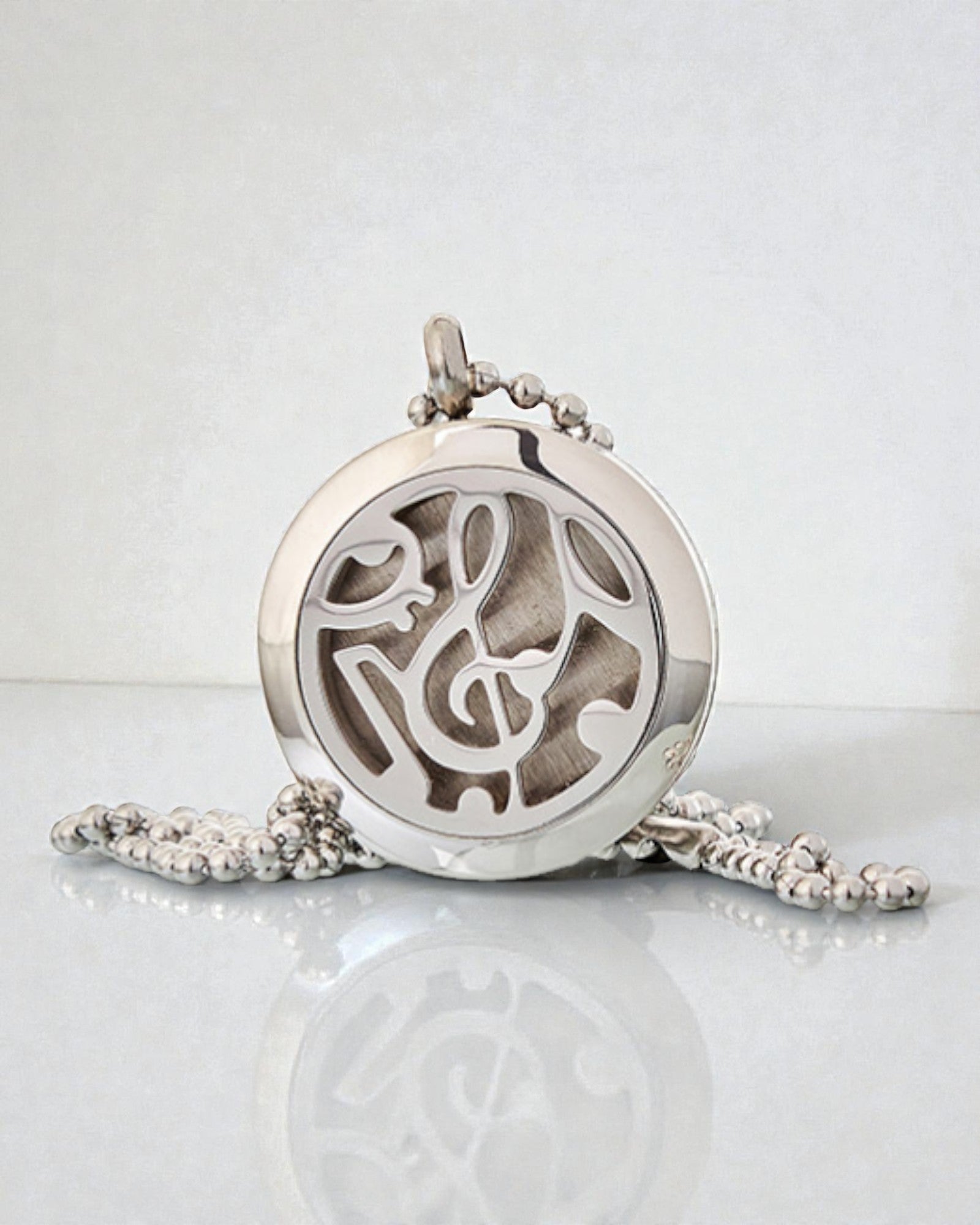 Sinfonia del Profumo – Collana di aromaterapia con motivo di note musicali 25 mm